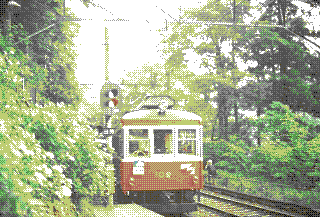 heavily dithered picture of red train in foresty area